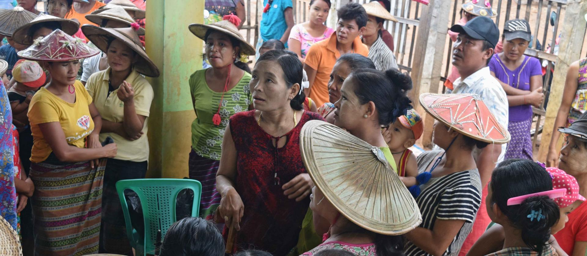 Villagers queue to receive the long-lasting insecticidal bed nets distributed free of charge with Global Fund support, Madauk village, Nyaung Lay Pin Township. Photo: UNOPS Villagers queue to receive the long-lasting insecticidal bed nets distributed free of charge with Global Fund support, Madauk village, Nyaung Lay Pin Township. Photo: UNOPS