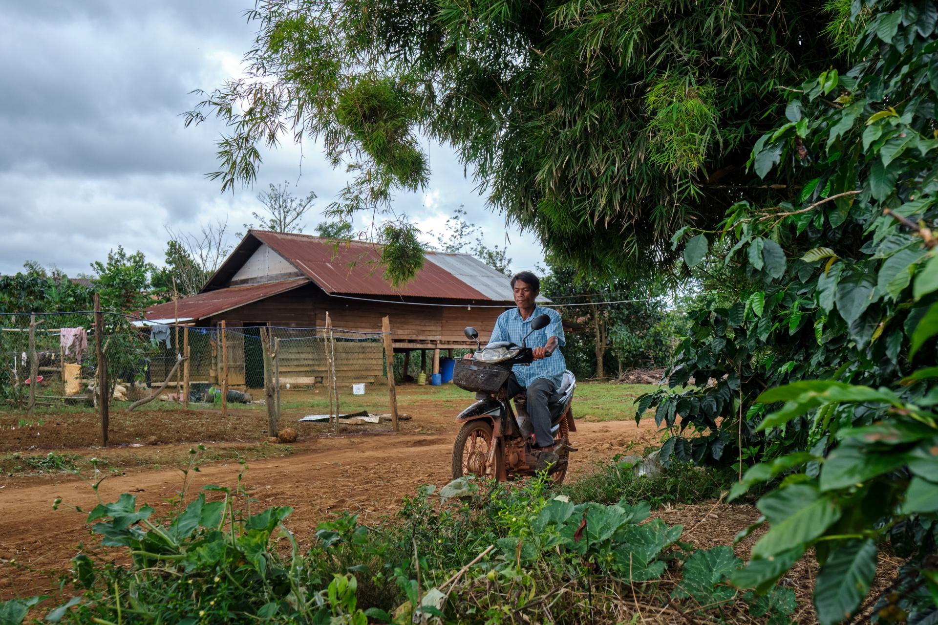 Village malaria worker Sisomphang conducting home visits on his motorbike. Photo: BART VERWEIJ Village malaria worker Sisomphang conducting home visits on his motorbike. Photo: BART VERWEIJ
