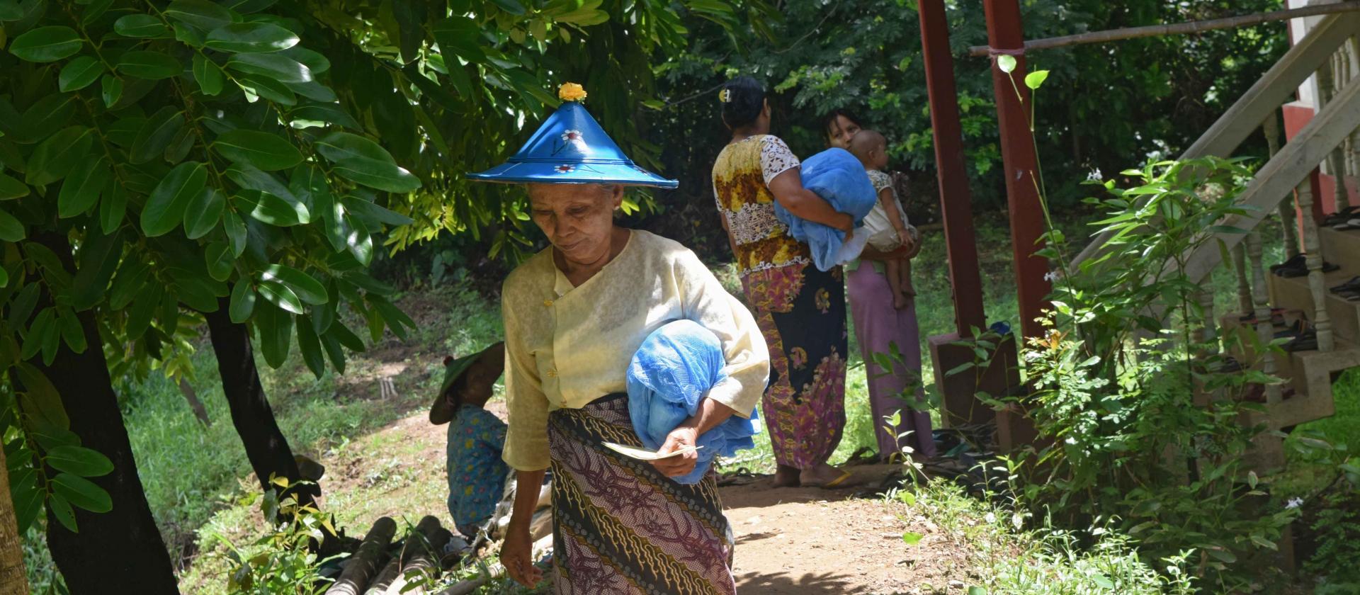 A Pazunmyaung villager with LLINs she has received. Photo: UNOPS A Pazunmyaung villager with LLINs she has received. Photo: UNOPS
