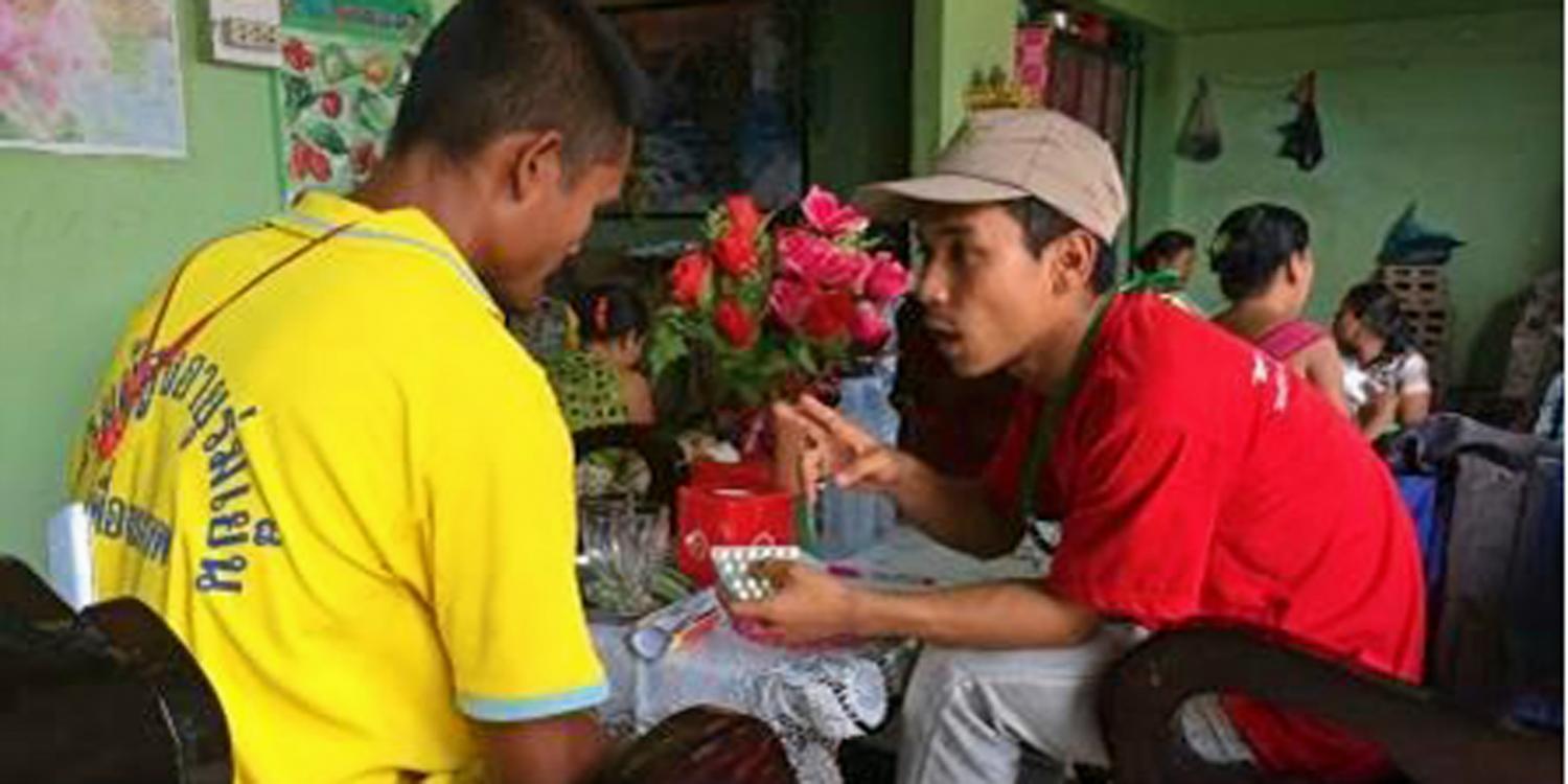 A staff member provides counselling and health education and malaria treatment to a migrant worker at ARC Shwe Hin Thar malaria corner point, Kawthaung Township. Photo: ARC