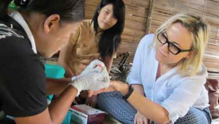 Namira Bosnjak, UNOPS RAI Coordinator, gets tested for malaria with a rapid diagnostic test at Tha Byu Chaung village Dawei Township. Photo: UNOPS